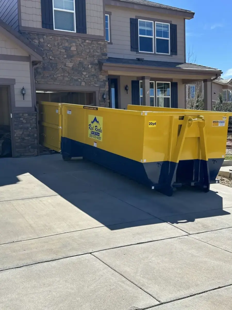 20 yard roll-off dumpster placed in a residential Denver driveway